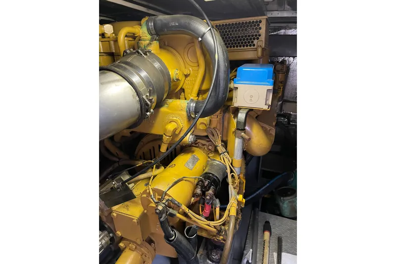 Offshore Flyer Yacht Photos Pics Engine compartment of 2000 Azimut 46 Flybridge MY, showcasing mechanical components.