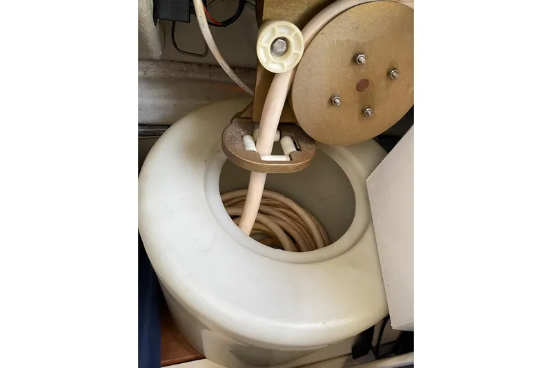 Offshore Flyer Yacht Photos Pics Azimut 46 Flybridge MY 2000 boat component with coiled hose and reel.