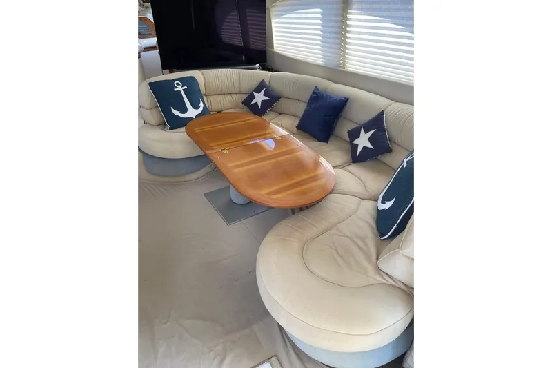 Offshore Flyer Yacht Photos Pics Luxurious interior of 2000 Azimut 46 Flybridge MY with elegant seating and nautical-themed cushions.