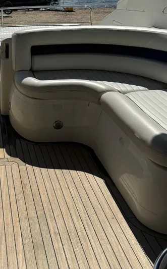  Yacht Photos Pics Luxury seating on a 2004 Princess V65 yacht with wooden deck.