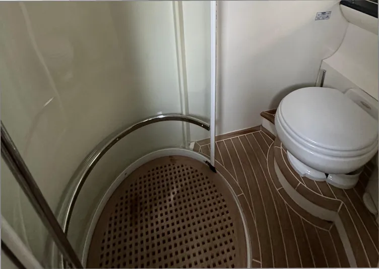  Yacht Photos Pics Bathroom interior of 2004 Princess V65 yacht with shower and toilet.