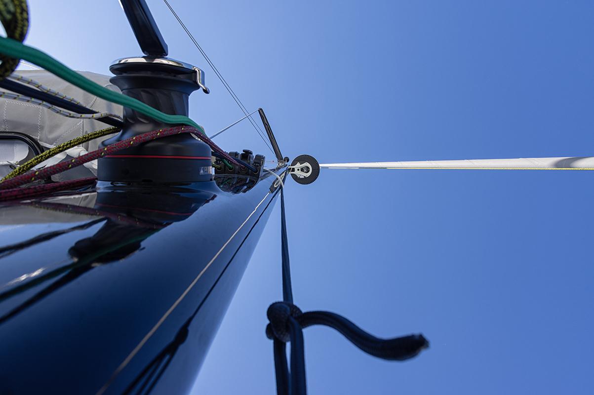 Looking up a Comar C-Cat 48 mast against a clear blue sky, 2025 model.