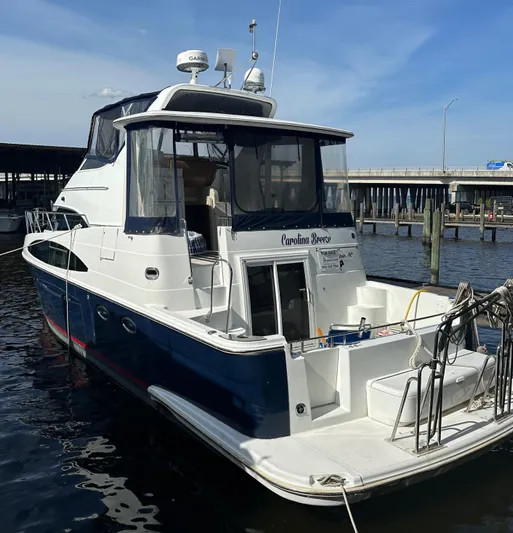 Carolina Breeze Yacht Photos Pics 2002 Carver 444 Cockpit Motor Yacht docked at marina.