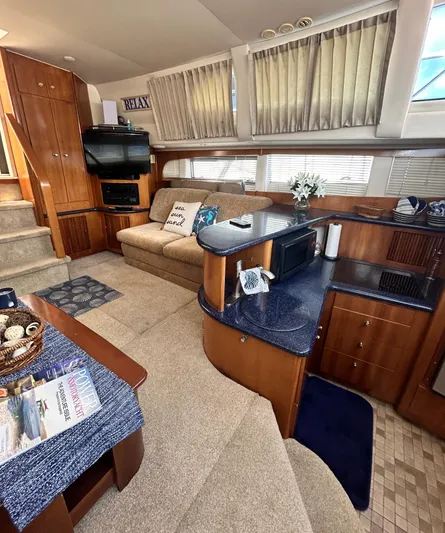 Carolina Breeze Yacht Photos Pics 2002 Carver 444 Cockpit Motor Yacht interior with cozy seating and modern amenities.