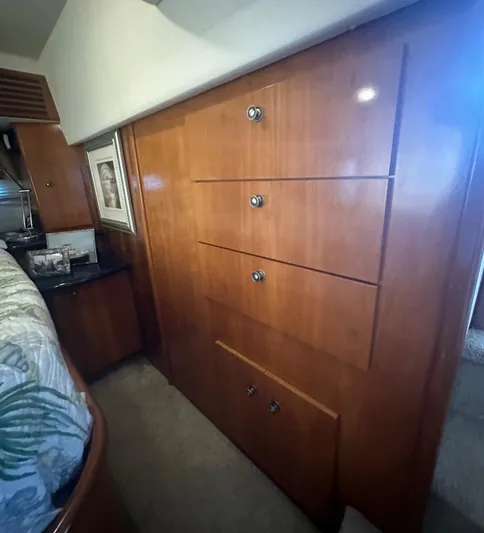 Carolina Breeze Yacht Photos Pics Wooden cabinetry in the 2002 Carver 444 Cockpit Motor Yacht bedroom.