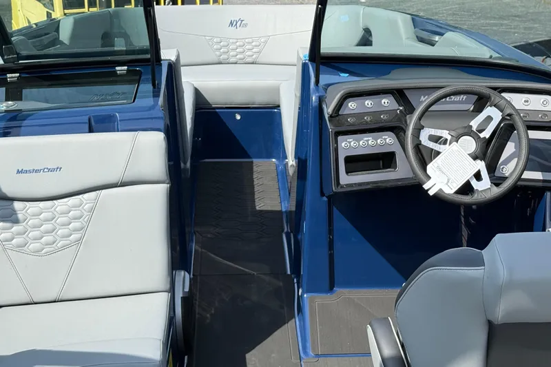 Yacht Photos Pics Interior of 2026 MasterCraft NXT24 boat with modern dashboard and seating.