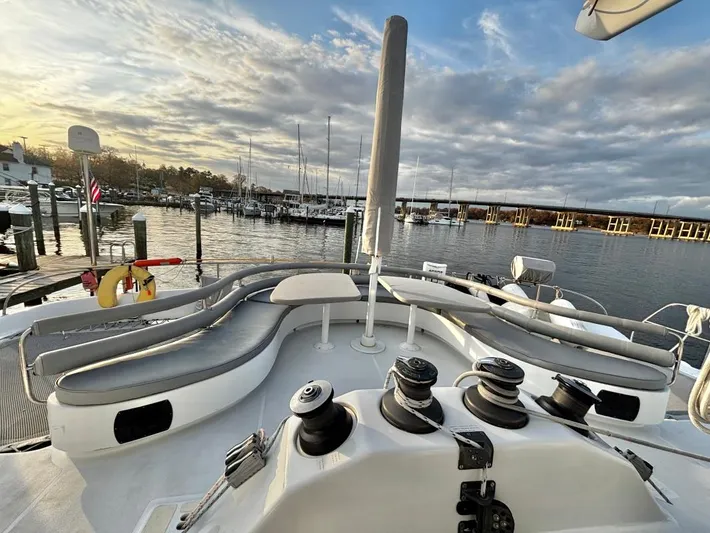 Fat Cat Yacht Photos Pics Luxurious 1991 Custom Morelli-Miller yacht deck with seating, docked at scenic marina.