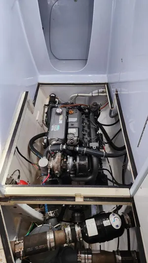 Fat Cat Yacht Photos Pics Engine compartment of a 1991 Custom Morelli-Miller, showcasing detailed mechanical components.