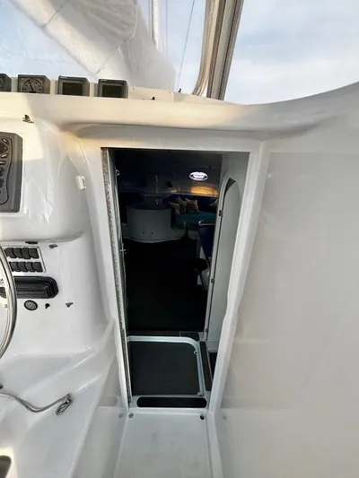 Fat Cat Yacht Photos Pics Interior view of a 1991 Custom Morelli-Miller boat, showing cabin entrance and control panel.