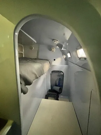 Fat Cat Yacht Photos Pics Interior of a 1991 Custom Morelli-Miller, featuring a compact sleeping area.