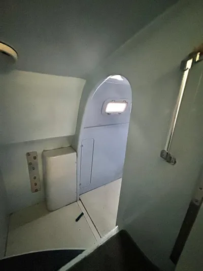 Fat Cat Yacht Photos Pics Interior of a 1991 Custom Morelli-Miller vehicle, featuring a compact, minimalist design.