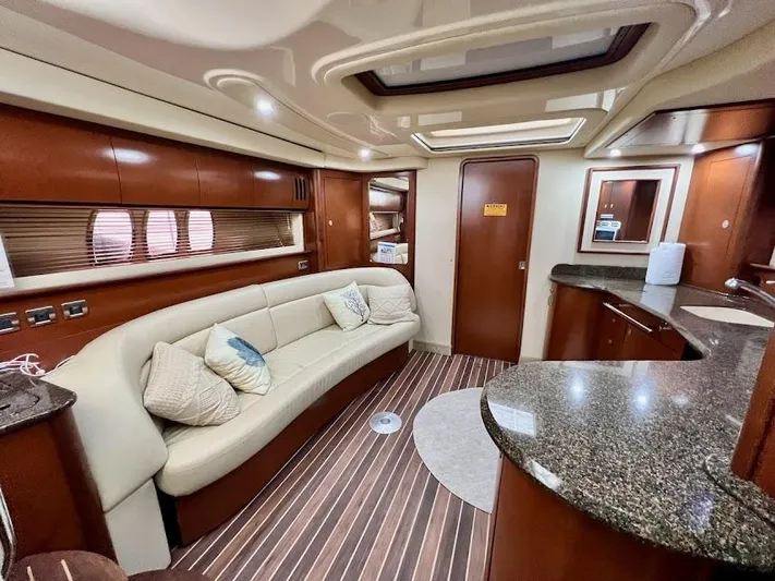  Yacht Photos Pics Luxurious interior of 2007 Sea Ray 44 Sundancer yacht with elegant seating and modern amenities.