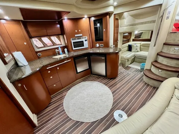  Yacht Photos Pics Luxurious interior of 2007 Sea Ray 44 Sundancer yacht with modern kitchen and seating area.