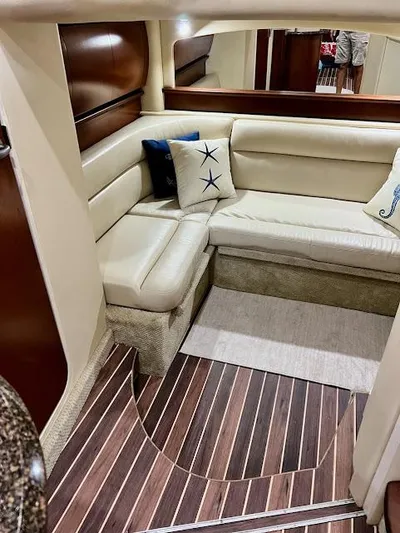  Yacht Photos Pics 2007 Sea Ray 44 Sundancer interior with beige seating and nautical-themed pillows.