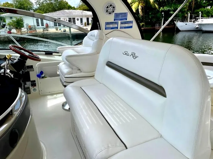  Yacht Photos Pics 2007 Sea Ray 44 Sundancer interior with white seating and waterfront view.