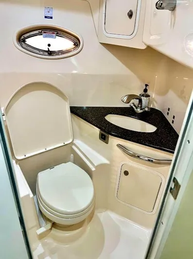  Yacht Photos Pics 2007 Sea Ray 44 Sundancer bathroom with toilet, sink, and storage cabinets.