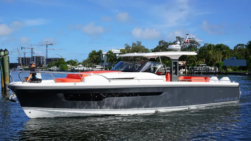 In-stock 2024 Nimbus T11 #260 Yacht Photos Pics 2024 Nimbus Tender 11 #260 boat cruising on a sunny day, with modern design and sleek lines.