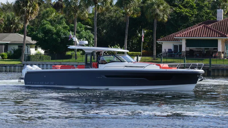 In-stock 2024 Nimbus T11 #260 Yacht Photos Pics 2024 Nimbus Tender 11 #260 cruising on a scenic waterway near lush greenery.
