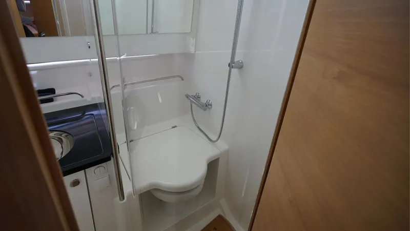 In-stock 2024 Nimbus T11 #260 Yacht Photos Pics Compact bathroom in 2024 Nimbus Tender 11 #260 with shower and sink.