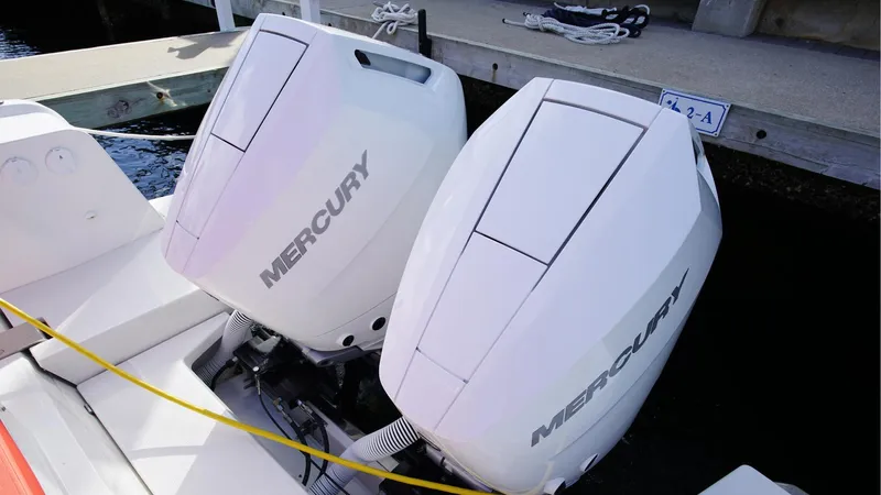 In-stock 2024 Nimbus T11 #260 Yacht Photos Pics Twin Mercury outboard engines on a 2024 Nimbus Tender 11 #260 boat at a dock.