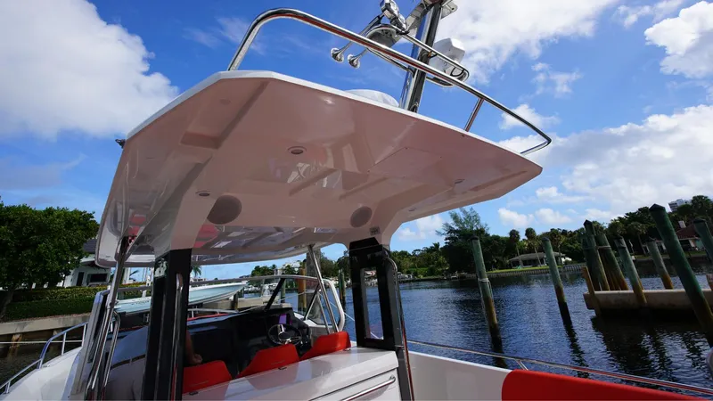 In-stock 2024 Nimbus T11 #260 Yacht Photos Pics 2024 Nimbus Tender 11 #260 boat docked under a clear blue sky.