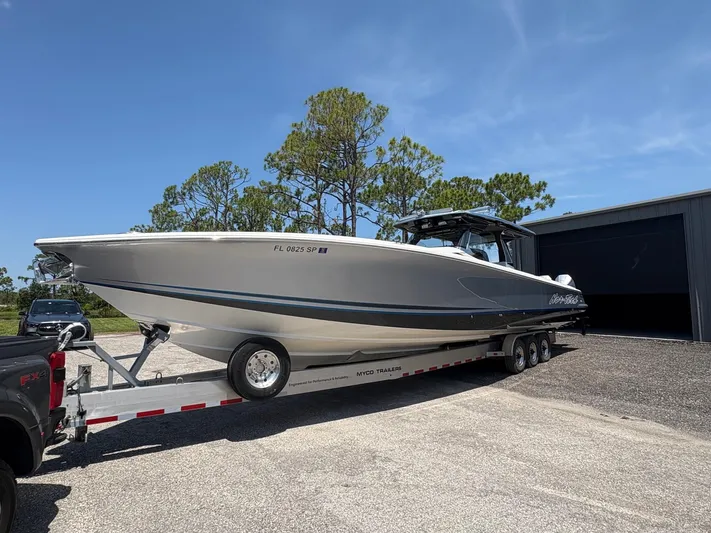  Yacht Photos Pics 2020 Nor-Tech 450 Sport Center Console boat on trailer, parked outdoors.