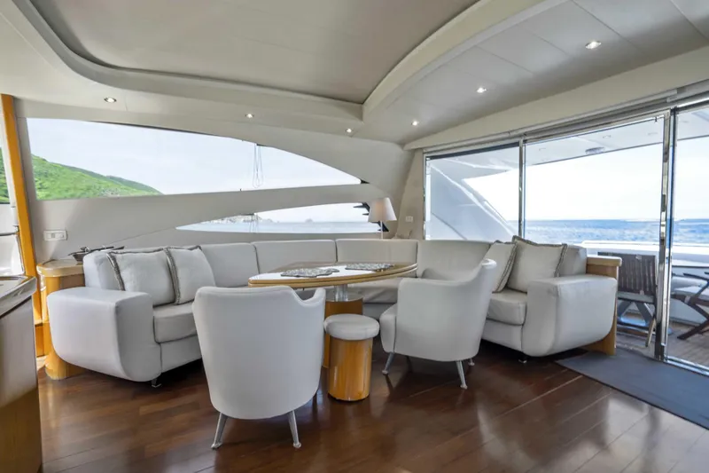 Denise Yacht Photos Pics Luxurious interior of 2005 Pershing 76 Motor Yacht with elegant seating and ocean view.