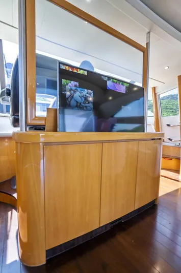 Denise Yacht Photos Pics Luxurious interior of a 2005 Pershing 76 Motor Yacht with a modern entertainment system.