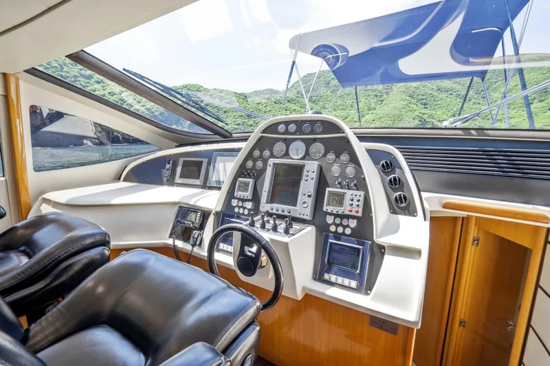 Denise Yacht Photos Pics 2005 Pershing 76 Motor Yacht helm with advanced navigation controls and leather seating.