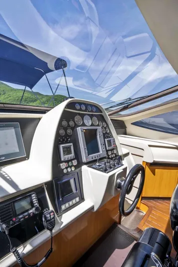 Denise Yacht Photos Pics 2005 Pershing 76 Motor Yacht helm station with advanced navigation controls.