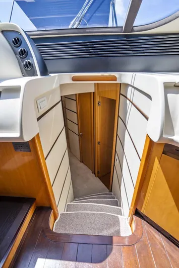 Denise Yacht Photos Pics Staircase leading to lower deck cabins on 2005 Pershing 76 Motor Yacht.