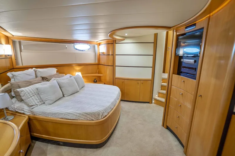 Denise Yacht Photos Pics Luxurious bedroom interior of 2005 Pershing 76 Motor Yacht with modern wood finishes.