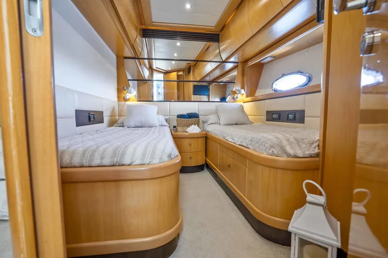 Denise Yacht Photos Pics Luxurious twin cabin interior of 2005 Pershing 76 Motor Yacht with wooden finishes.