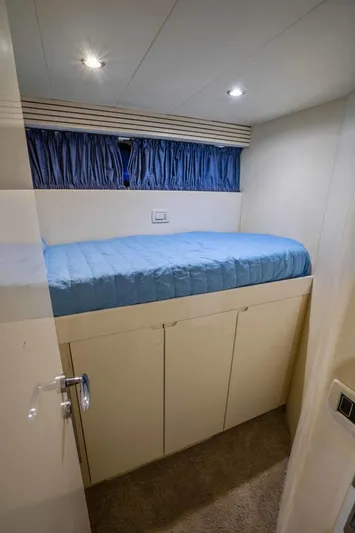 Denise Yacht Photos Pics 2005 Pershing 76 Motor Yacht cabin with bed and storage