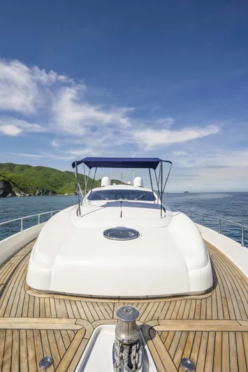 Denise Yacht Photos Pics 2005 Pershing 76 Motor Yacht with teak deck and blue canopy on open water.