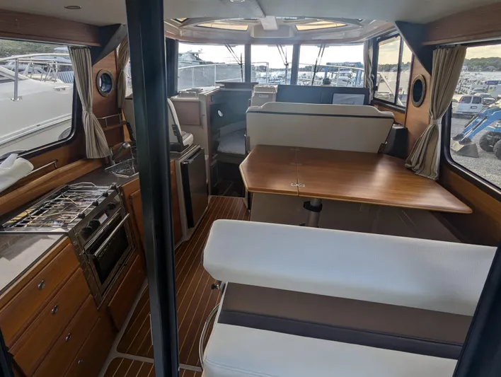  Yacht Photos Pics Interior of 2017 Ranger Tugs R-298 boat with kitchen and dining area.