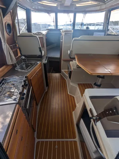  Yacht Photos Pics Interior of 2017 Ranger Tugs R-298 boat with wood flooring and modern amenities.