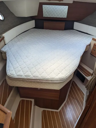  Yacht Photos Pics 2017 Ranger Tugs R-298 cabin interior with bed and wood flooring.