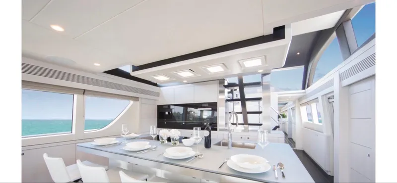 Nicostasia Yacht Photos Pics Luxurious interior of 2018 Van der Valk Raised Pilothouse 26m yacht with elegant dining area.