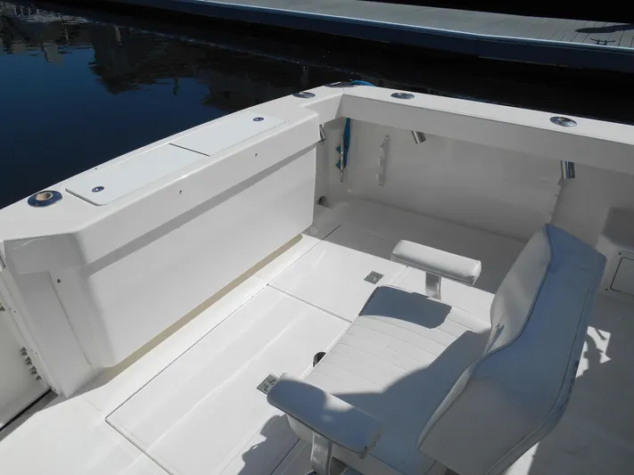 Mistress Yacht Photos Pics 1998 Cabo 31 Express boat interior with white seating and clean deck.