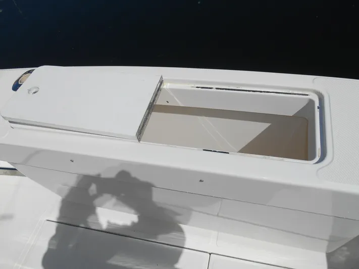 Mistress Yacht Photos Pics Open storage compartment on 1998 Cabo 31 Express boat deck.