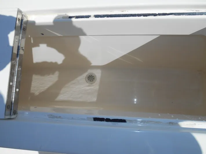 Mistress Yacht Photos Pics Open storage compartment on 1998 Cabo 31 Express boat.