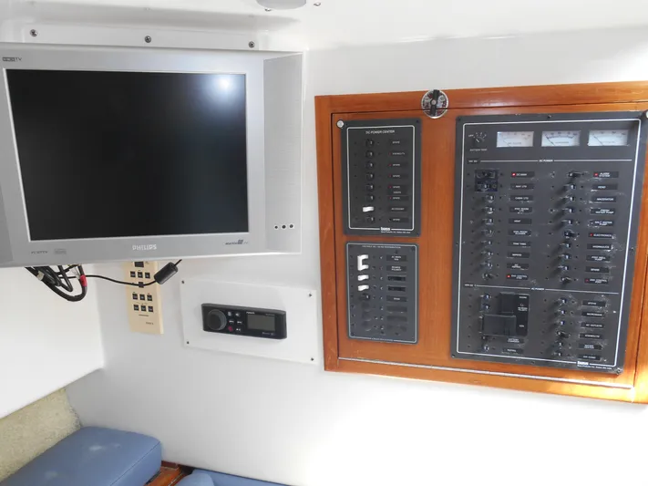 Mistress Yacht Photos Pics Control panel and monitor inside a 1998 Cabo 31 Express boat.