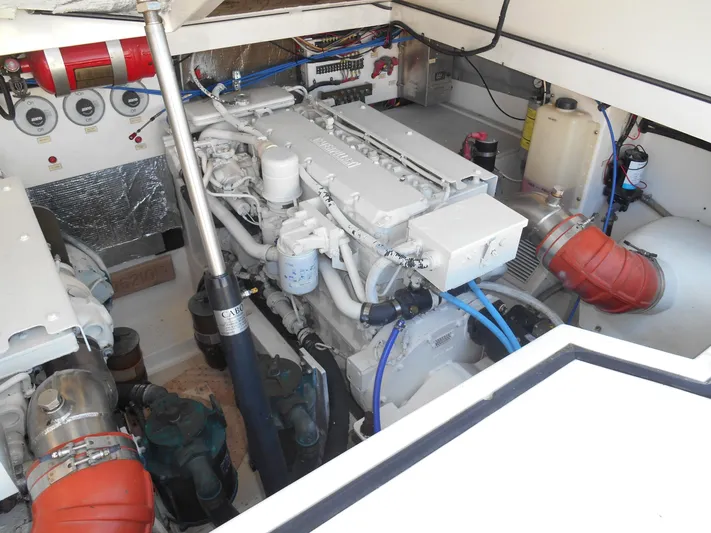 Mistress Yacht Photos Pics Engine room of a 1998 Cabo 31 Express boat, showcasing detailed mechanical components.