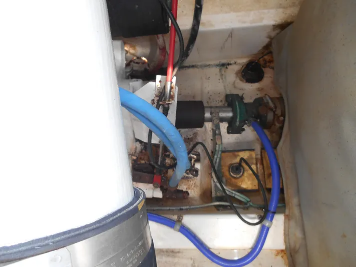 Mistress Yacht Photos Pics Engine compartment of 1998 Cabo 31 Express boat with visible hoses and components.