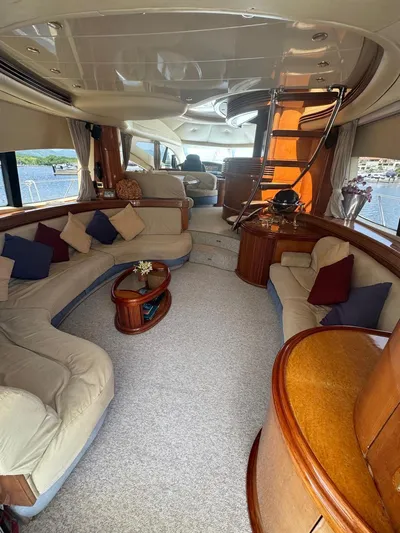 Stella Mia Yacht Photos Pics Luxurious interior of a 2001 Azimut 68 Plus yacht with elegant seating and decor.