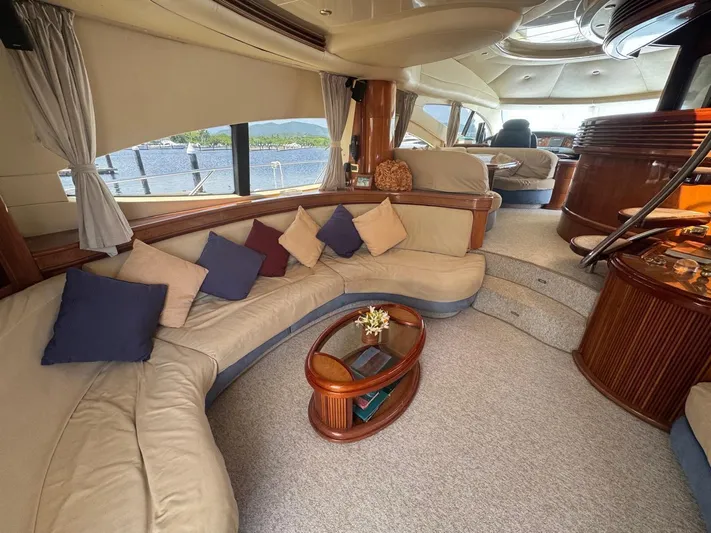 Stella Mia Yacht Photos Pics Luxurious interior of 2001 Azimut 68 Plus yacht with elegant seating and decor.