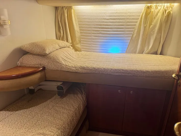 Stella Mia Yacht Photos Pics Cozy cabin interior with bunk beds on a 2001 Azimut 68 Plus yacht.