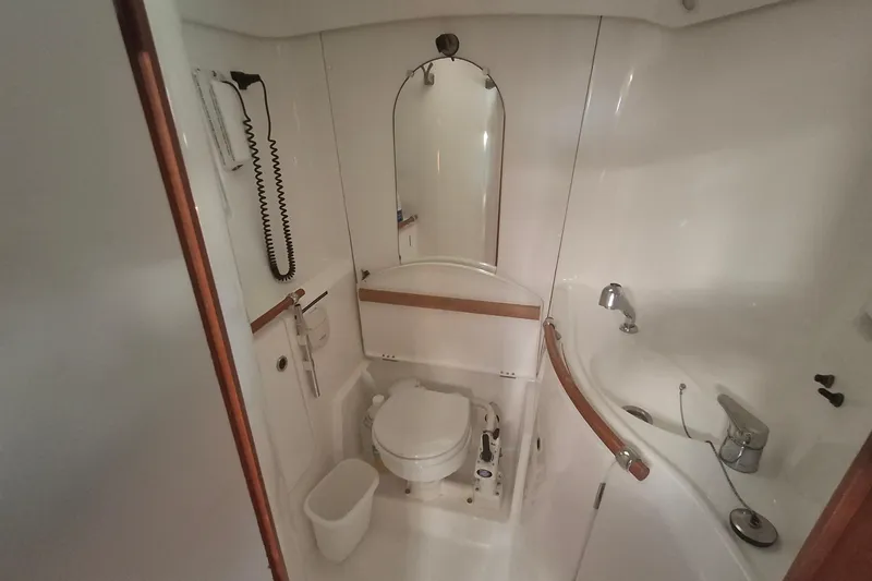 H2o Bungalow Yacht Photos Pics Bathroom interior of 2006 Beneteau Oceanis 393 yacht, featuring toilet and sink.