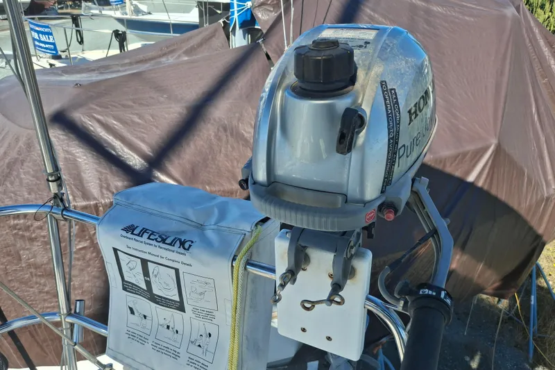 H2o Bungalow Yacht Photos Pics Outboard motor on 2006 Beneteau Oceanis 393 sailboat with Lifesling safety equipment.